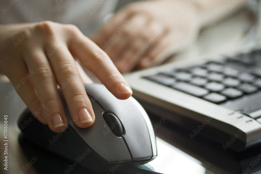 Businesswoman working with black computer mouse. Businesswoman working with black computer mouse.
