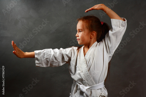 young girl in a white kimono, karate
