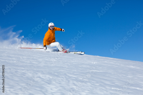 carving at clear blue sky