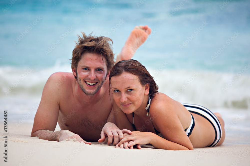 happy honeymoon couple on the beach happy honeymoon couple on the beach