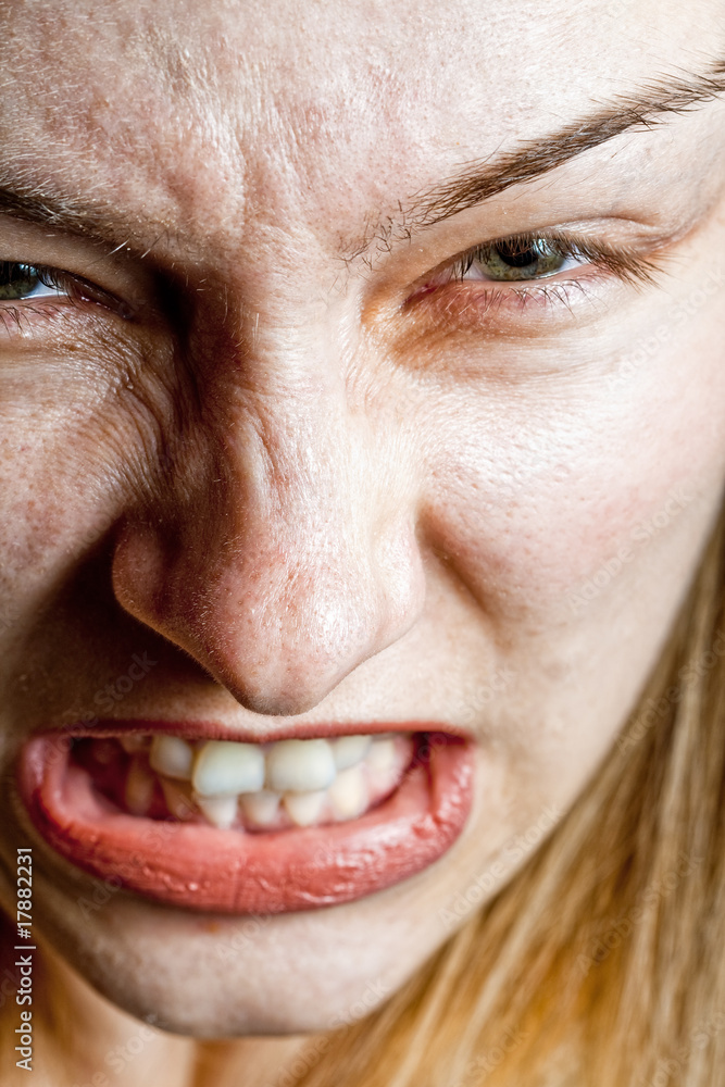 Stress concept - closeup on angry displeased woman Stress concept - closeup on angry displeased woman