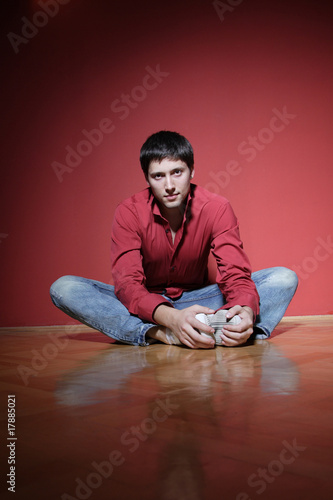 sexy young man on red background