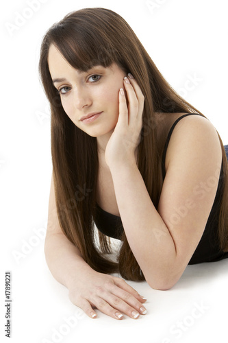 Studio Portrait Of Teenage Girl On White Background