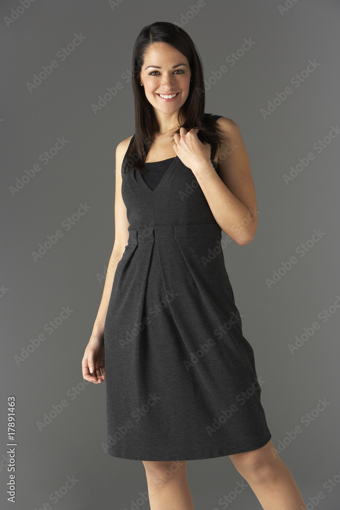 Studio Portrait Of Fashionably Dressed Woman Studio Portrait Of Fashionably Dressed Woman