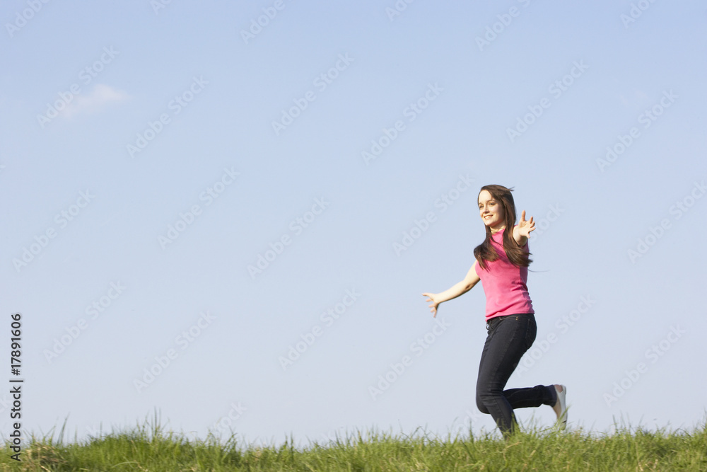 Teenage Girl Running Through Summer Meadow Teenage Girl Running Through Summer Meadow