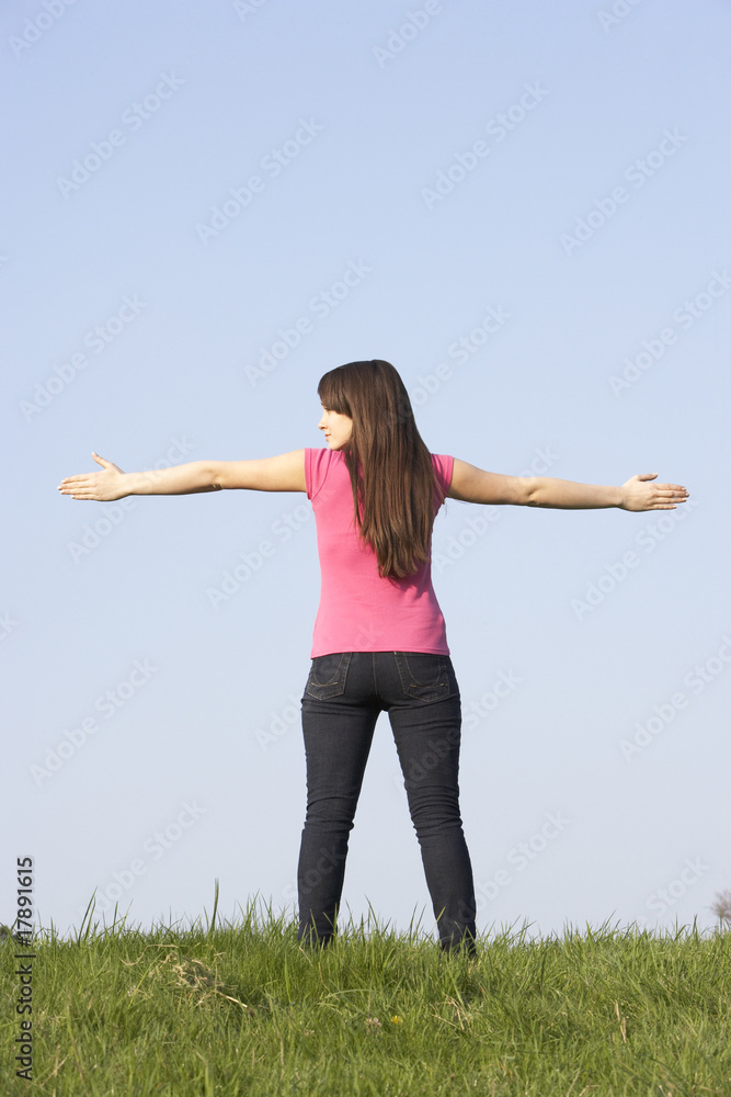 Teenage Girl Standing In Summer Meadow Teenage Girl Standing In Summer Meadow