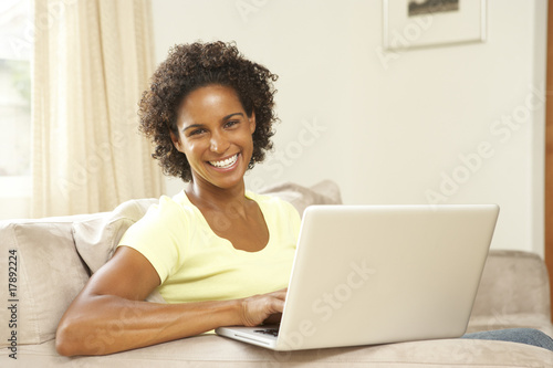 Woman Using Laptop At Home