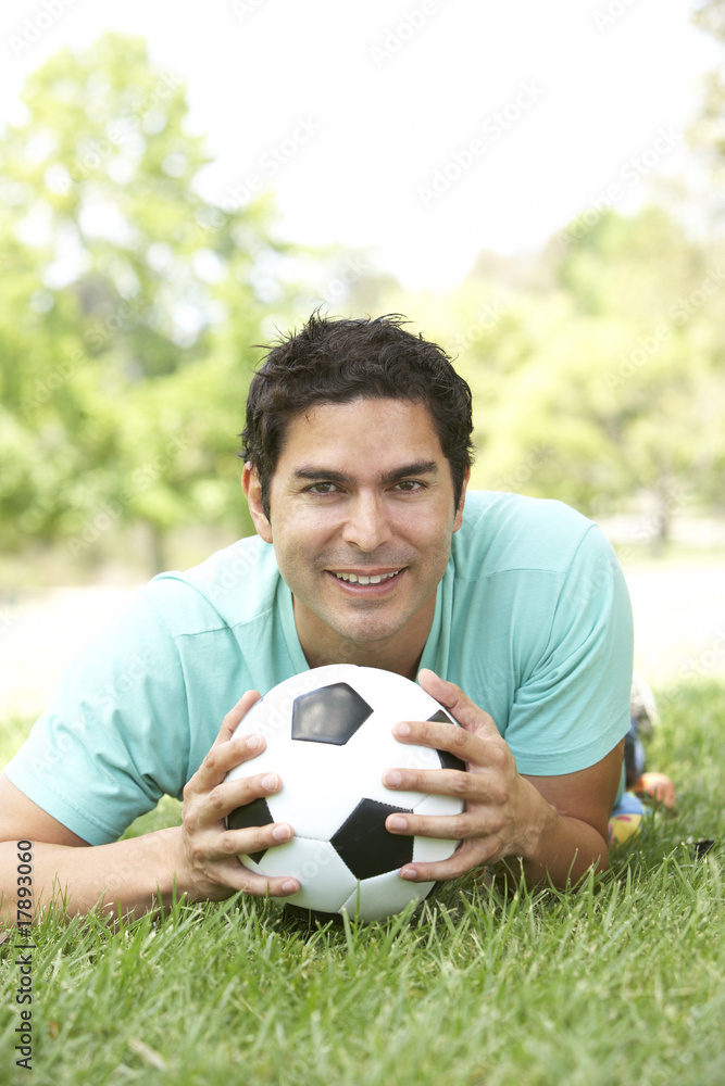 Portrait Of Young Man In Park With Football Portrait Of Young Man In Park With Football