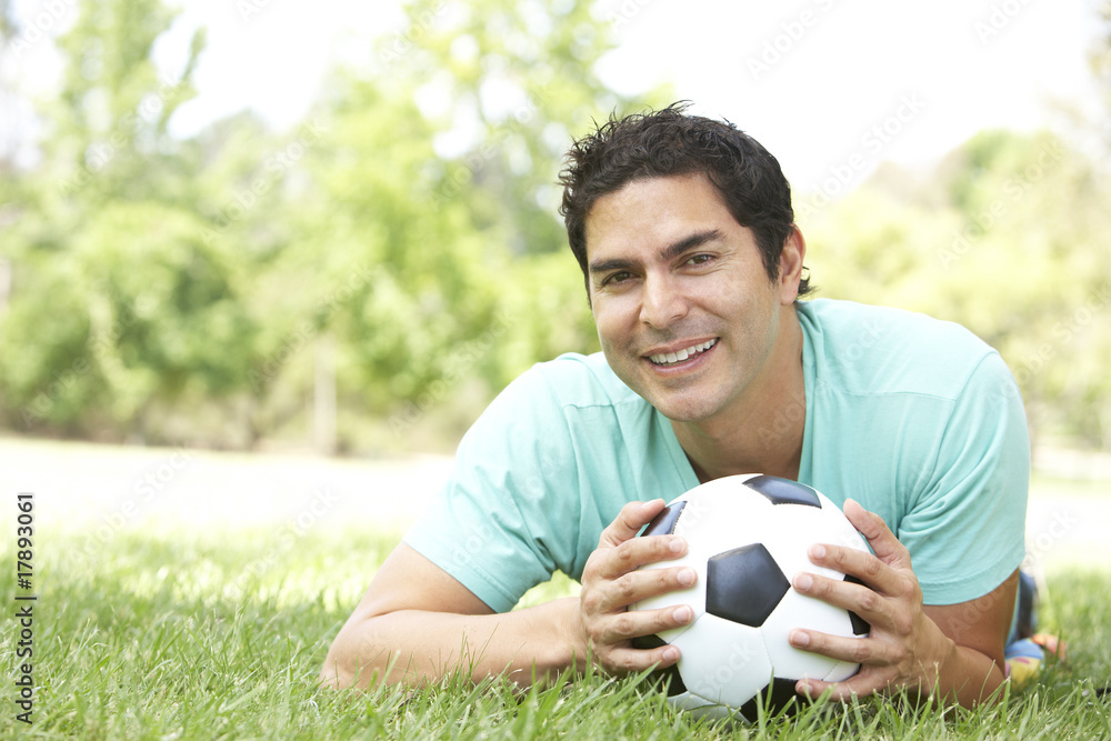 Portrait Of Young Man In Park With Football Portrait Of Young Man In Park With Football