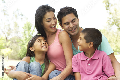 Portrait Of Young Family In Park