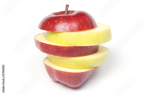 Sliced two-colour apple, isolated on white