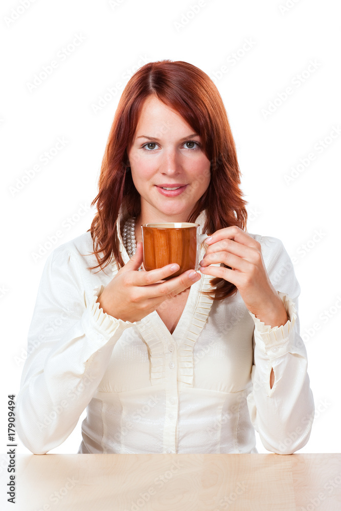 Woman drinking tea with cup under her face Woman drinking tea with cup under her face