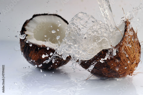 cracked coconut splashing © Denis Tabler