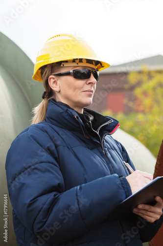 Construciton engineer taking notes