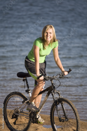 Woman riding bike smiling