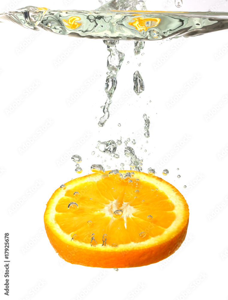 Splashing orange in water