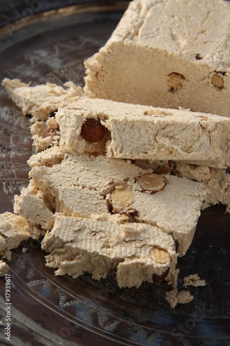 Halva with almonds, made of crushed sesame seeds and honey