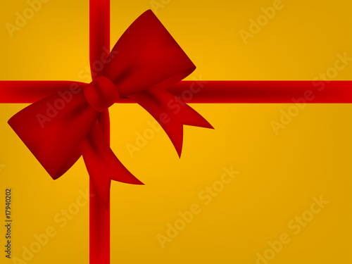 red satin bow on gold background