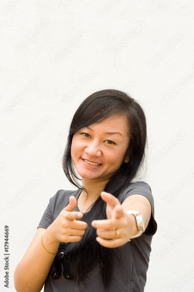 young woman pointing at you young woman pointing at you