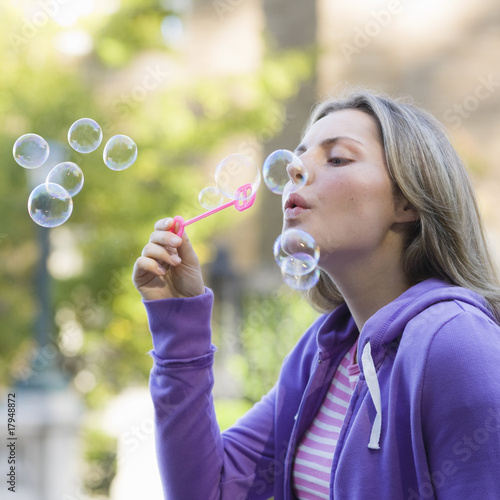 Teen Girl Blowing Bubbles