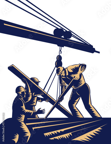 Construction workers hoisting timber on boom