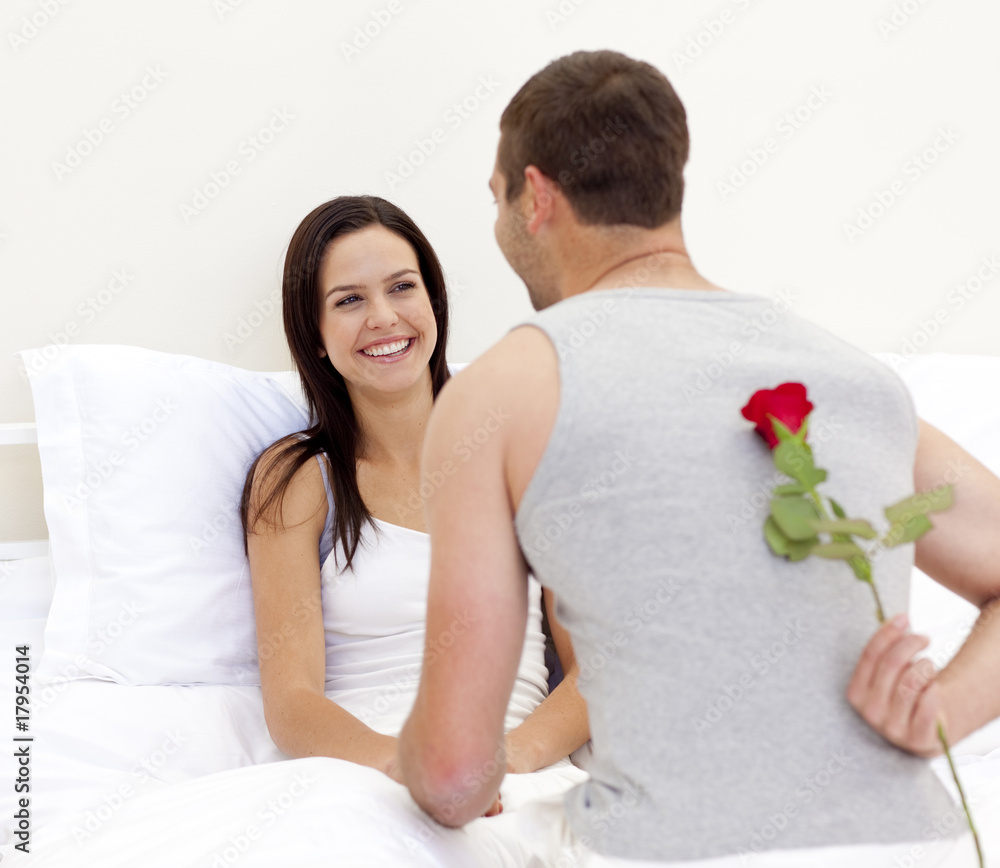 Man giving a rose to his beautiful wife Man giving a rose to his beautiful wife