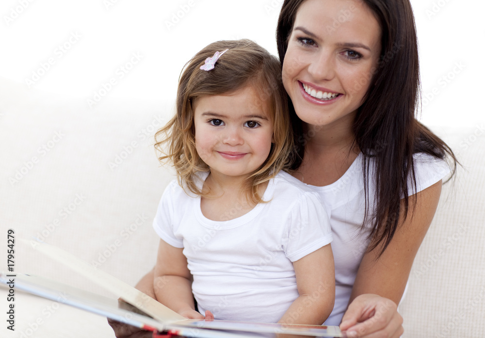 Portrait of mother and daughter reading a book Portrait of mother and daughter reading a book