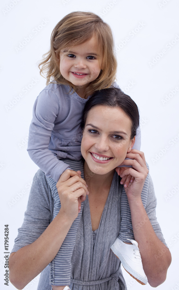 Mother giving her daughter piggyback ride Mother giving her daughter piggyback ride