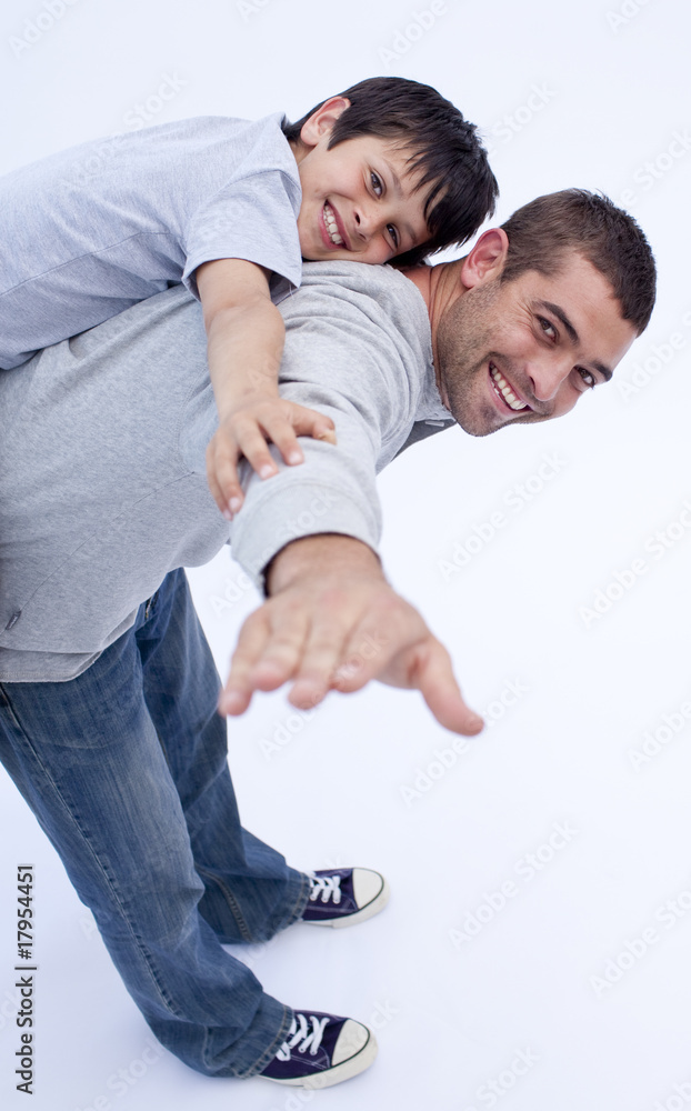 Smiling father and son playing together Smiling father and son playing together