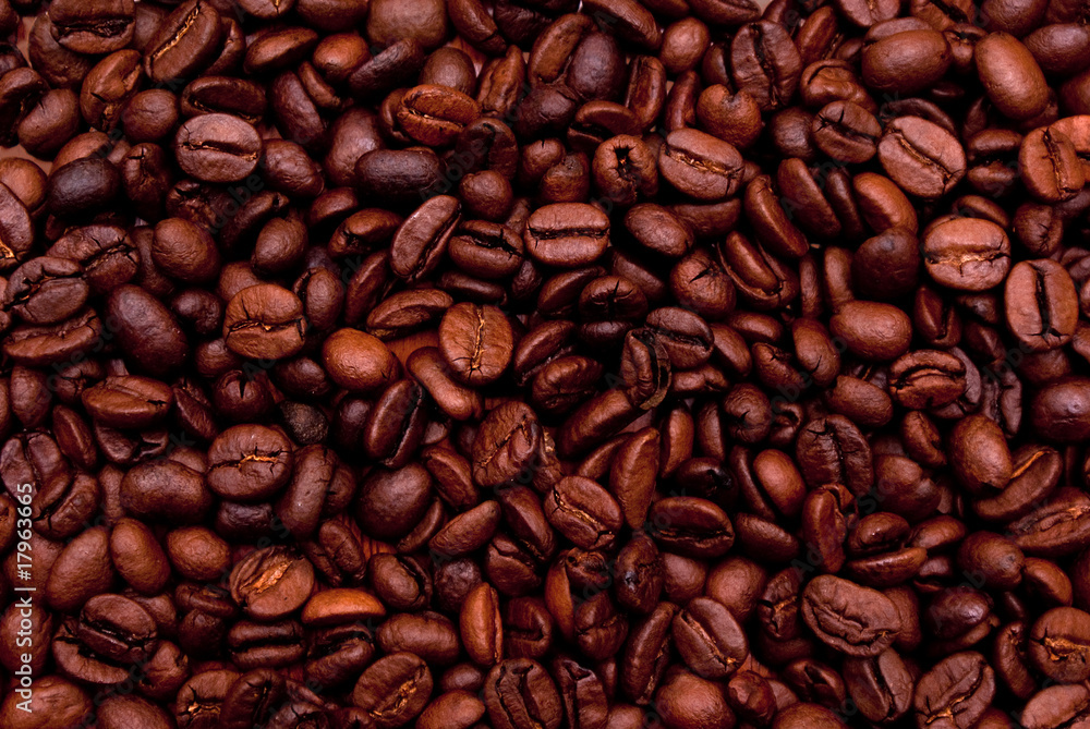 Top view of brown coffee beans forming background Top view of brown coffee beans forming background
