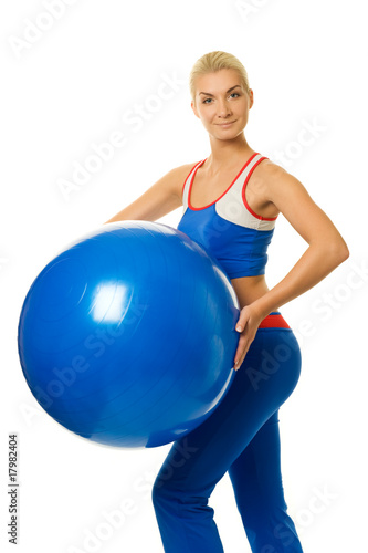 Beautiful fitness trainer with a ball ....