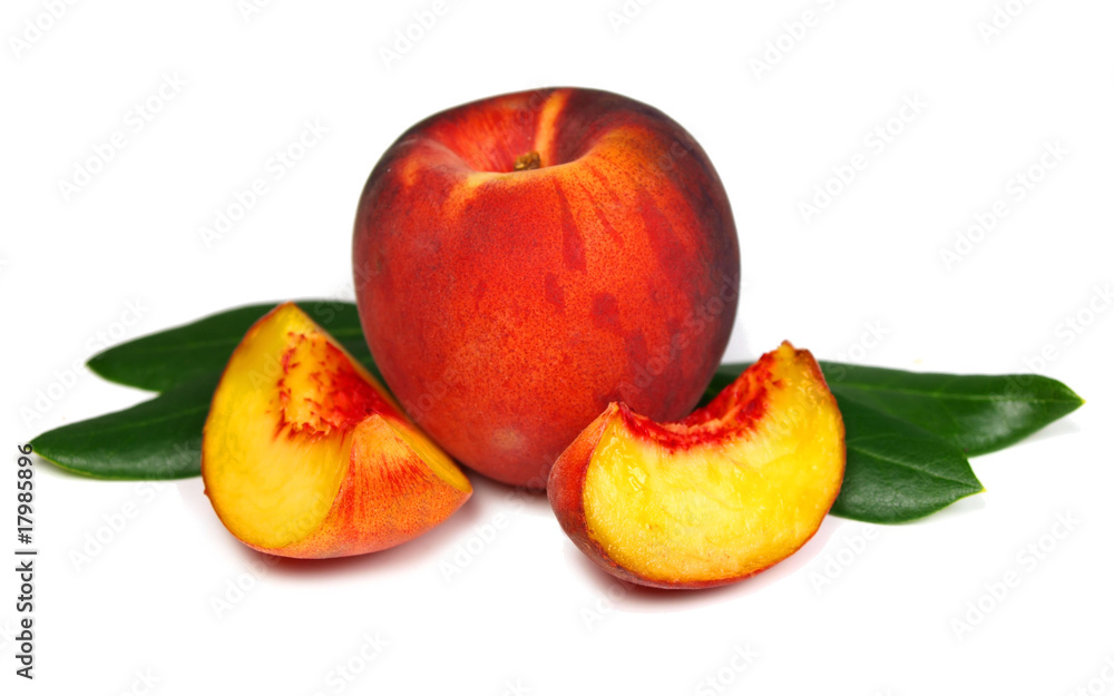 Peach with slices and leaves isolated on white Peach with slices and leaves isolated on white