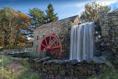 old grist mill with water wheel used to power grinding stones photo