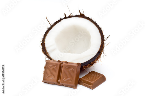 Halved coconut with chocolate blocks photo