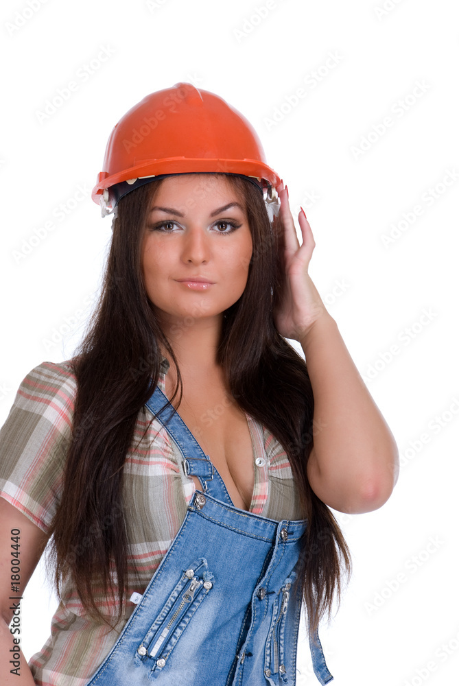 Young woman in orange helmet holding hammer drill Young woman in orange helmet holding hammer drill