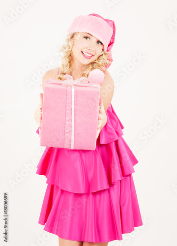 cheerful santa helper girl with gift box