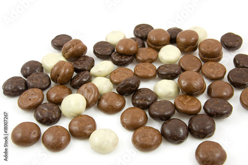 chocolate gingernuts, pepernoten over white background
