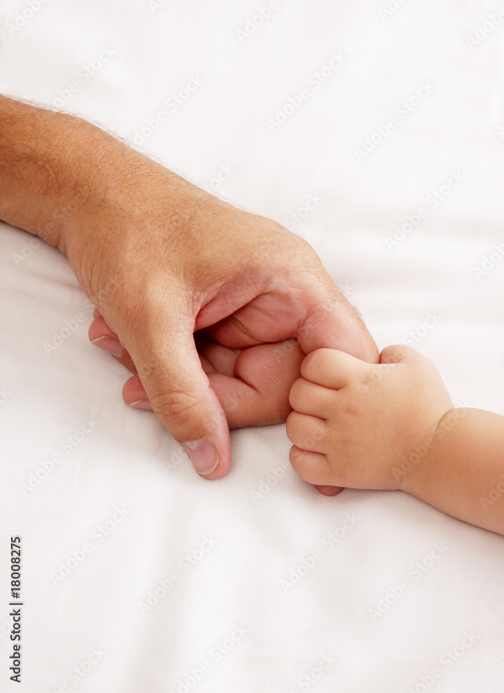 Baby holding dads hand Baby holding dads hand