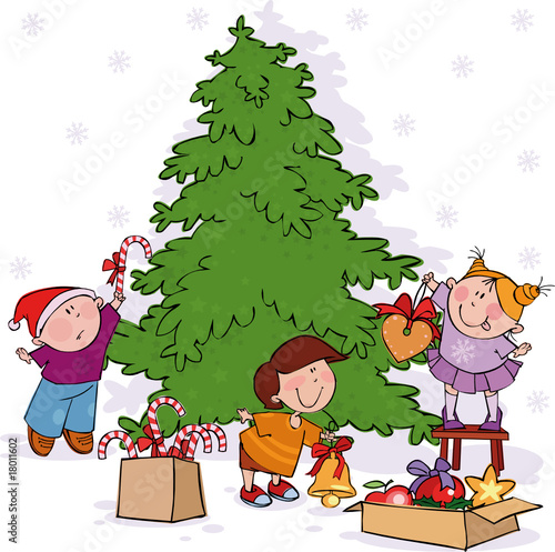 Little kids decorate a Christmas tree.