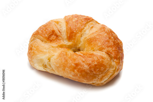 A whole croissant on white