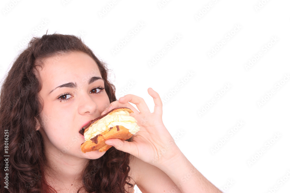 Young girl eating a yumy cake