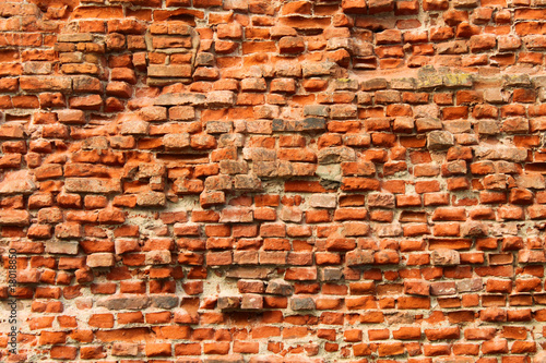 The weathered brick wall