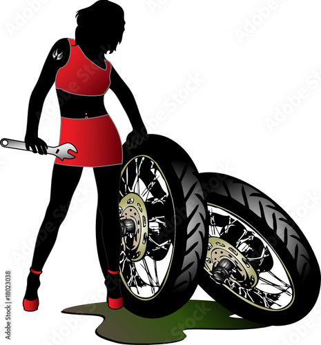 Pretty woman with wrench and wheels