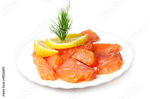 Fillet of salty salmon with greens and lemon