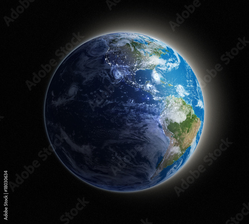 Earth seen from space with lights glowing in urban areas.