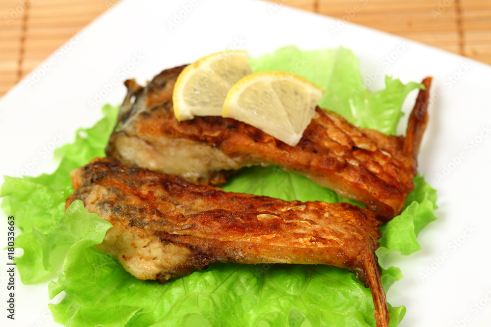 Roasted fresh bream on a plate Roasted fresh bream on a plate