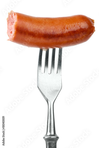 Half eaten sausage on fork