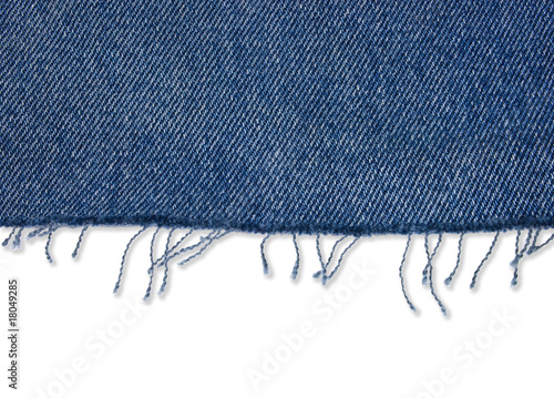 Piece of jeans fabric with fringe