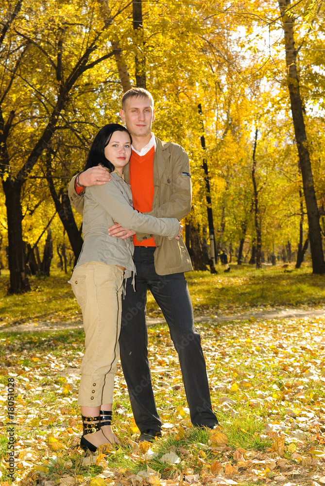 man and woman in autumn park man and woman in autumn park