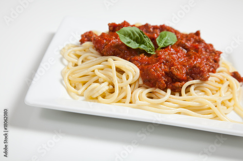 Plate of spaghetti on white